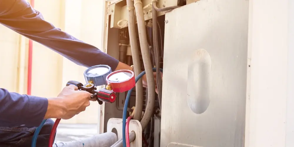 Checking pressure in an air conditioner