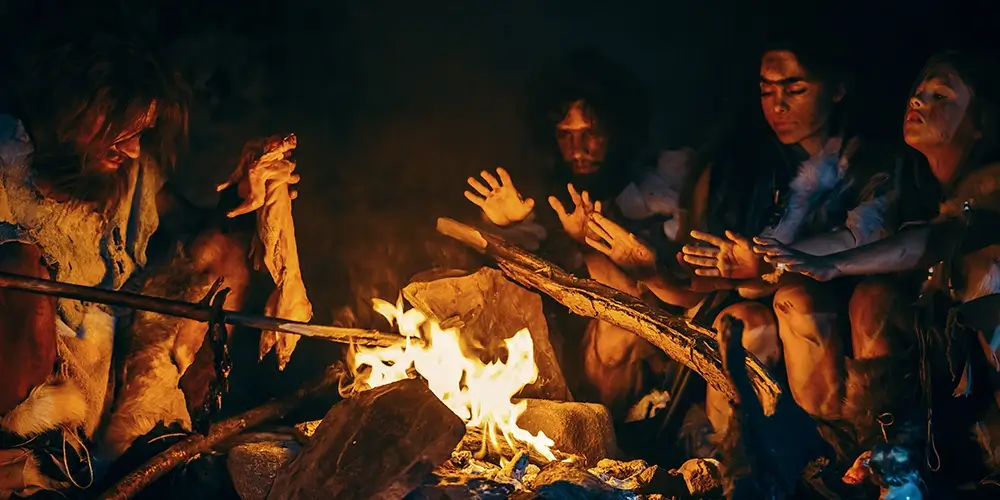 Prehistoric family by the fire