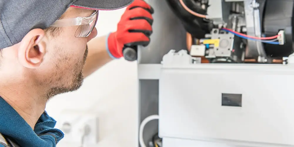 Technician inspecting a new furnace